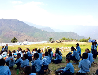 Thakani Sindhulpalchowk's children at the site for the new school