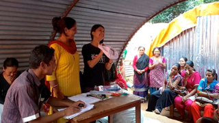 The girls enjoy a giggle at one of Binita's sanitary wear how-to classes